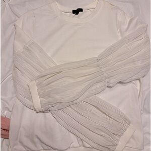 Nice top. Dressy but cute with jeans. Never worn.